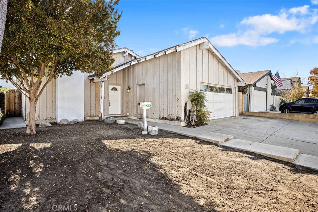 a view of a house with wooden fence