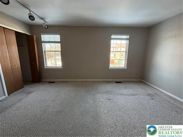 a view of an empty room with a window