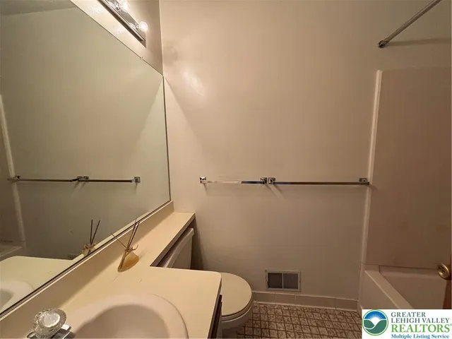 a bathroom with a sink and a shower
