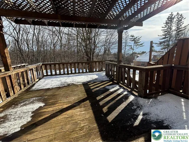 a view of house with wooden fence