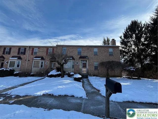 a view of a patio with table and chairs a barbeque with wooden fence