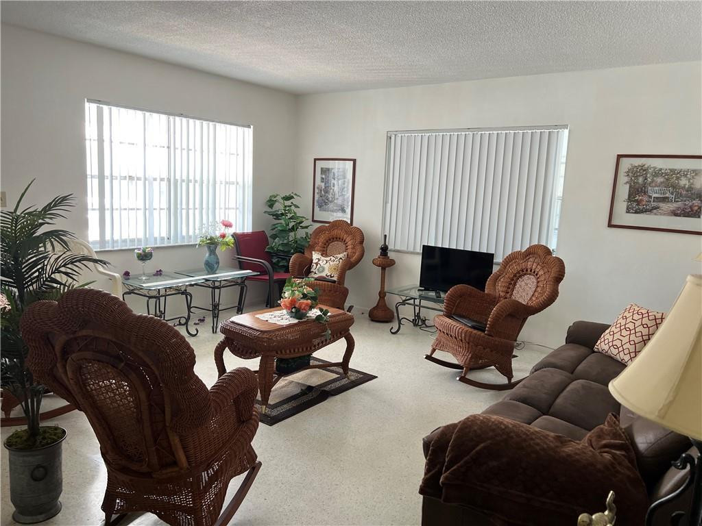 1833 Monroe Street, Unit 17 Hollywood, FL 33020 - Photo 4 of 9 a living room with furniture or couch and a window