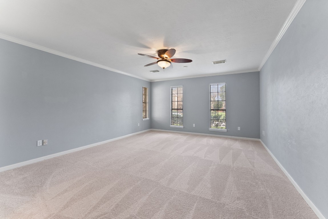16927 Windypine Drive Spring, TX 77379 - Photo 16 of 46 a view of a room with a ceiling fan and a window