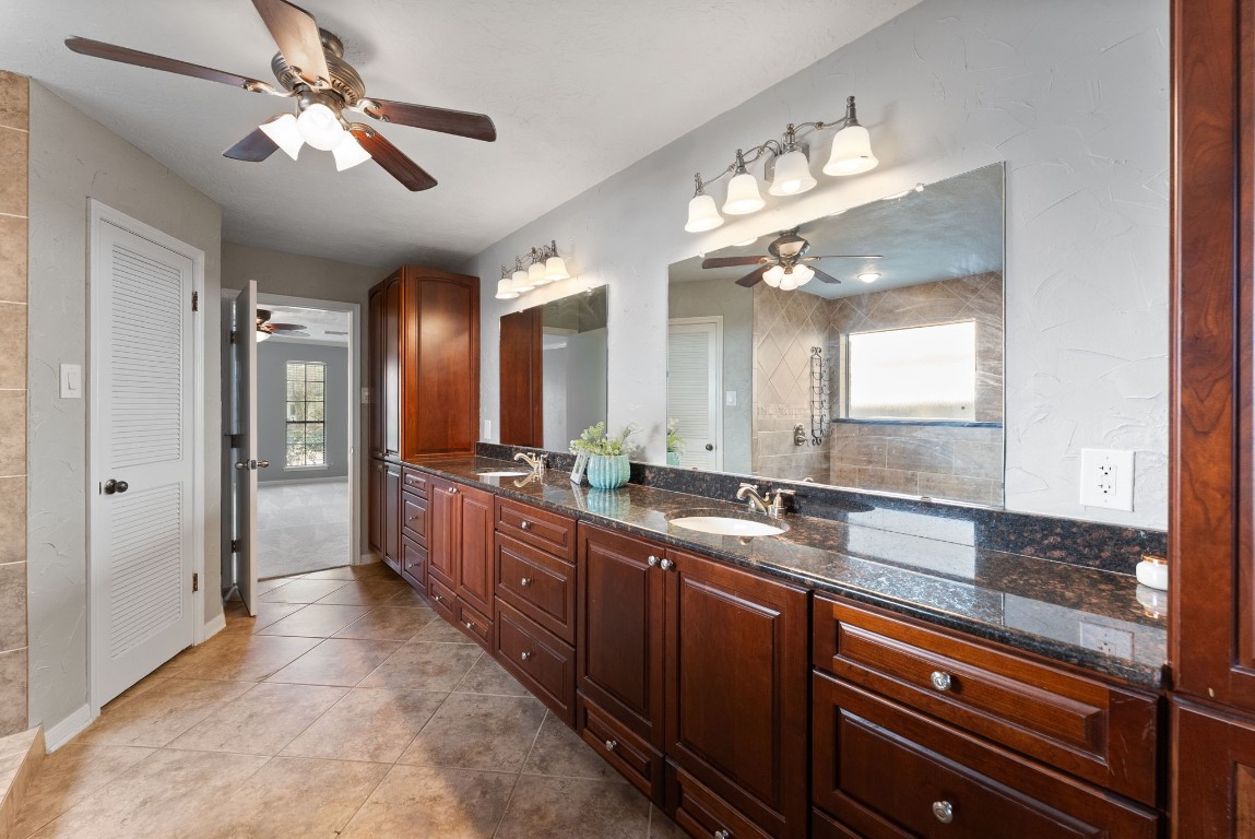 16927 Windypine Drive Spring, TX 77379 - Photo 19 of 46 a large kitchen with a large island in the center and a large window