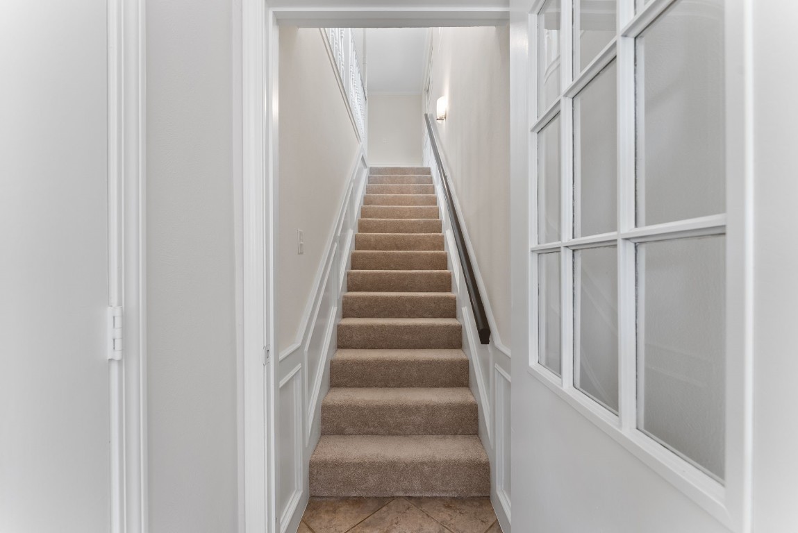 16927 Windypine Drive Spring, TX 77379 - Photo 43 of 46 a view of staircase with wooden floor and white walls