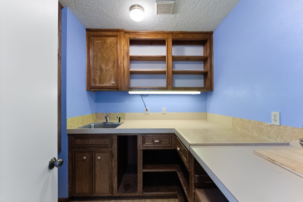 16927 Windypine Drive Spring, TX 77379 - Photo 23 of 46 a kitchen with a sink and cabinets