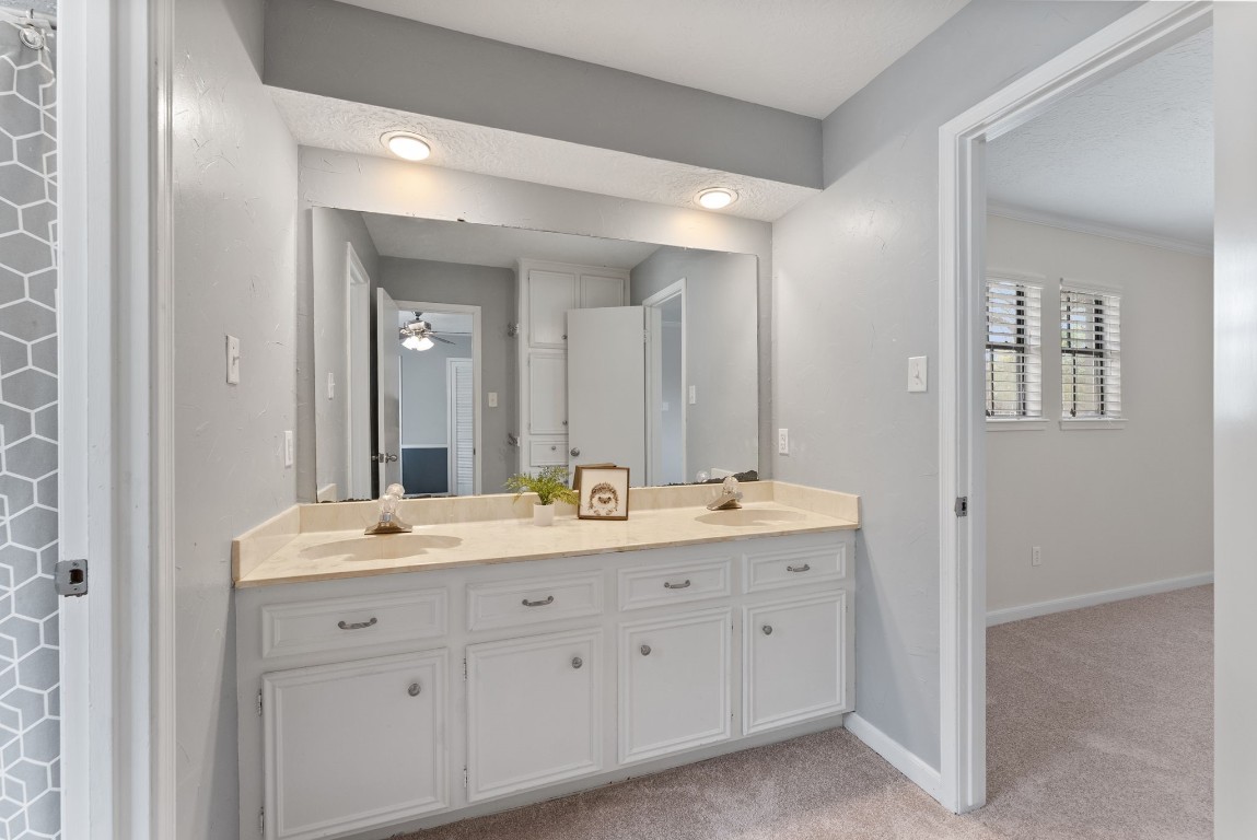 16927 Windypine Drive Spring, TX 77379 - Photo 44 of 46 a spacious bathroom with a granite countertop sink double and mirror