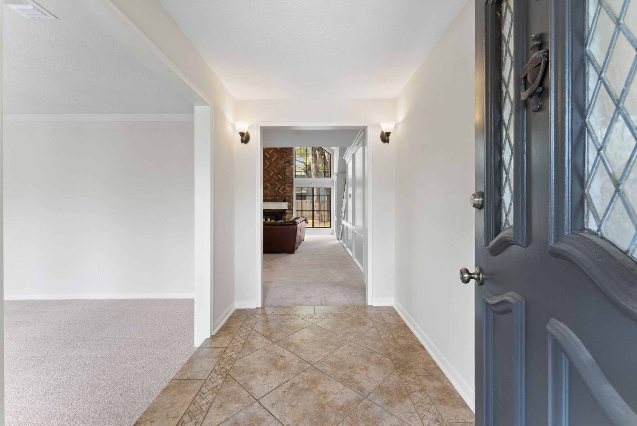 16927 Windypine Drive Spring, TX 77379 - Photo 5 of 46 a view of a hallway with wooden floor and living room