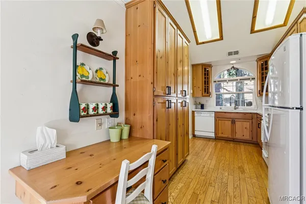 a kitchen with stainless steel appliances granite countertop a sink and cabinets