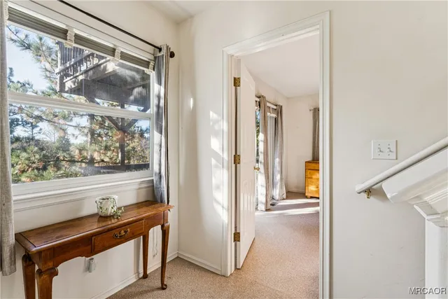 a view of a balcony with wooden floor