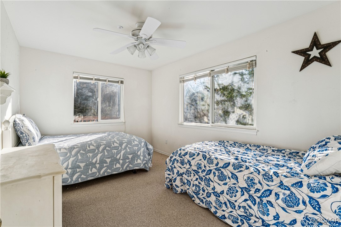 305 Summit Road Lake Arrowhead, CA 92352 - Photo 26 of 47 a bedroom with a bed and a window