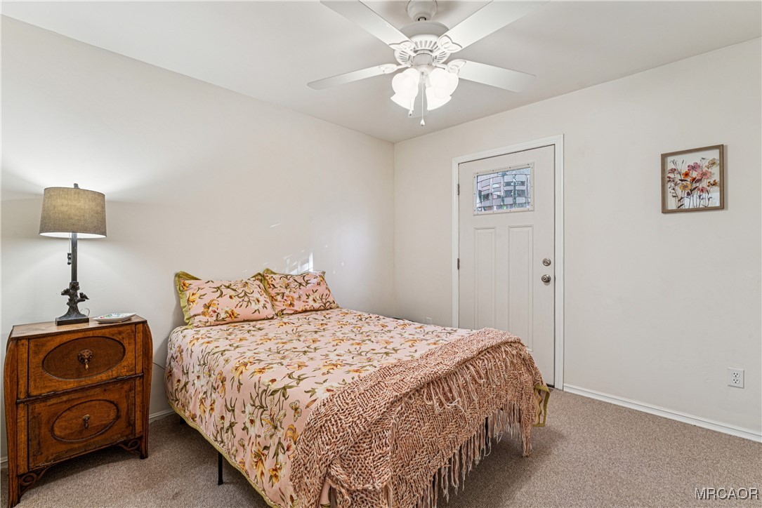 305 Summit Road Lake Arrowhead, CA 92352 - Photo 30 of 47 a bedroom with a bed and a chandelier