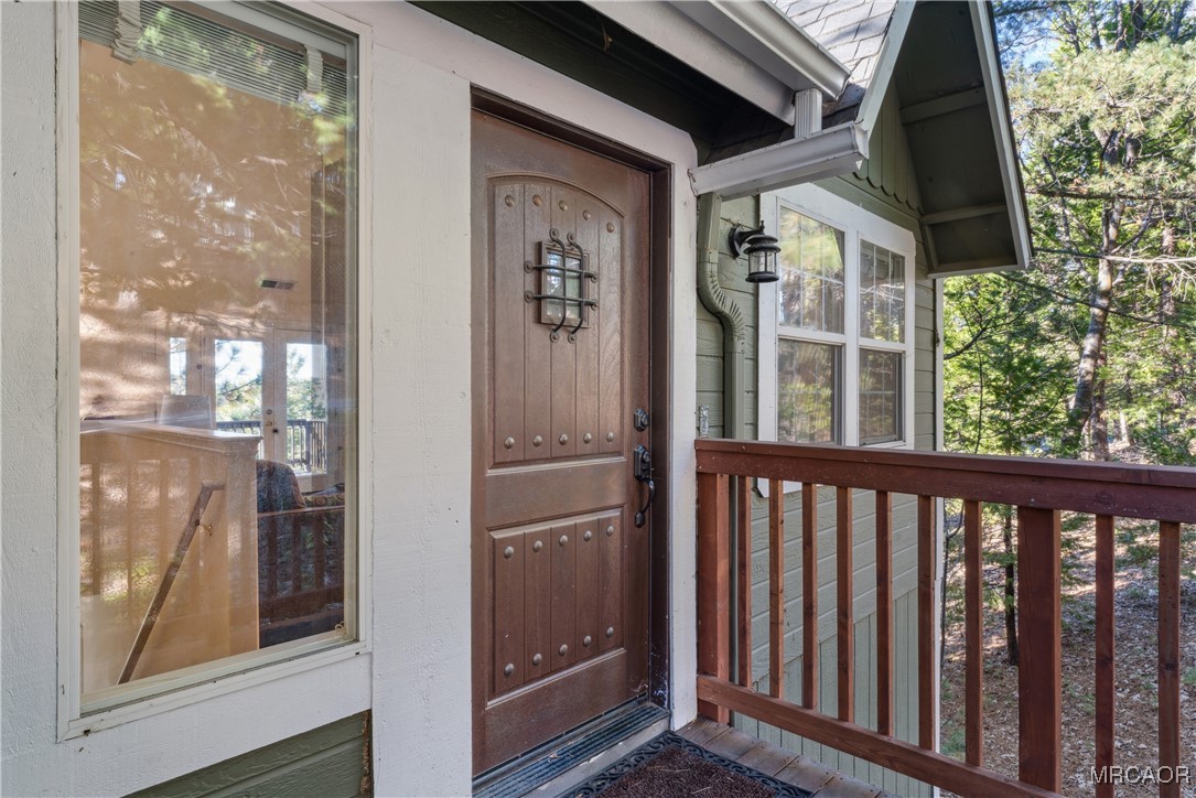 305 Summit Road Lake Arrowhead, CA 92352 - Photo 4 of 47 a view of a balcony with a door
