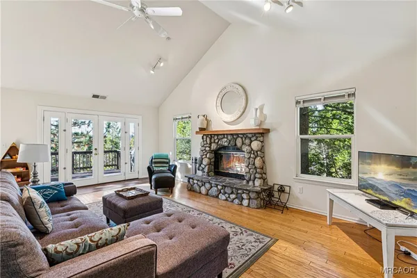 a living room with furniture and a fireplace