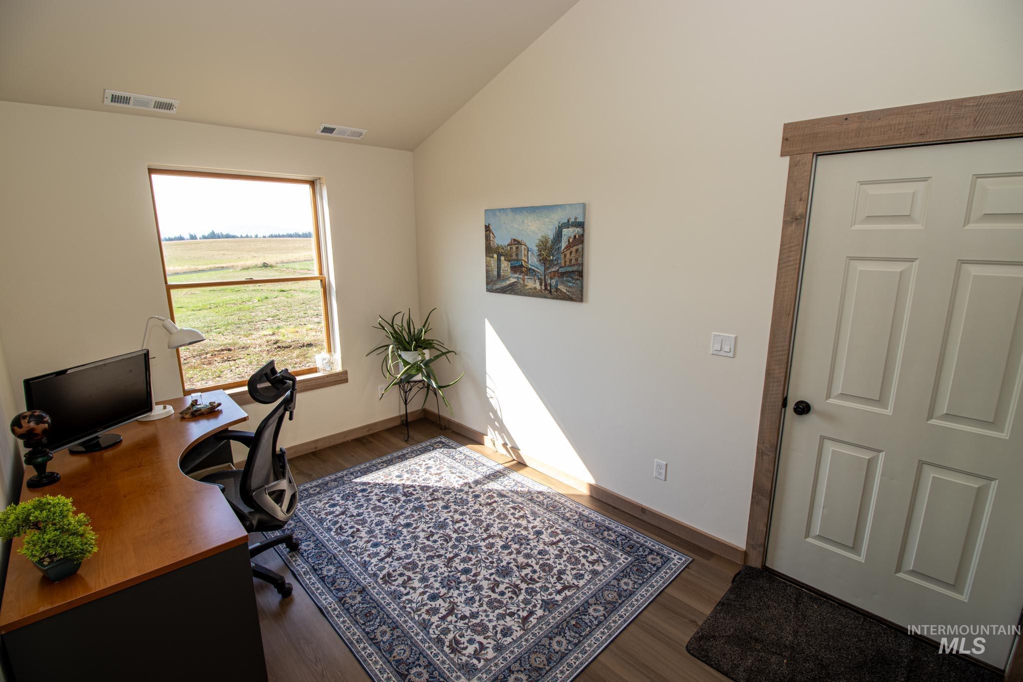 263 Glory Lane Orofino, ID 83544 - Photo 15 of 48 Home office featuring vaulted ceiling and wood finished floors