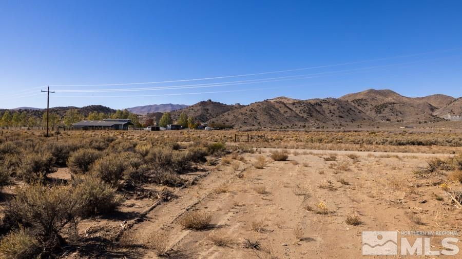 1285 Antelope Valley Road Reno, NV 89508 - Photo 9 of 9 a view of a field with a mountain in the background