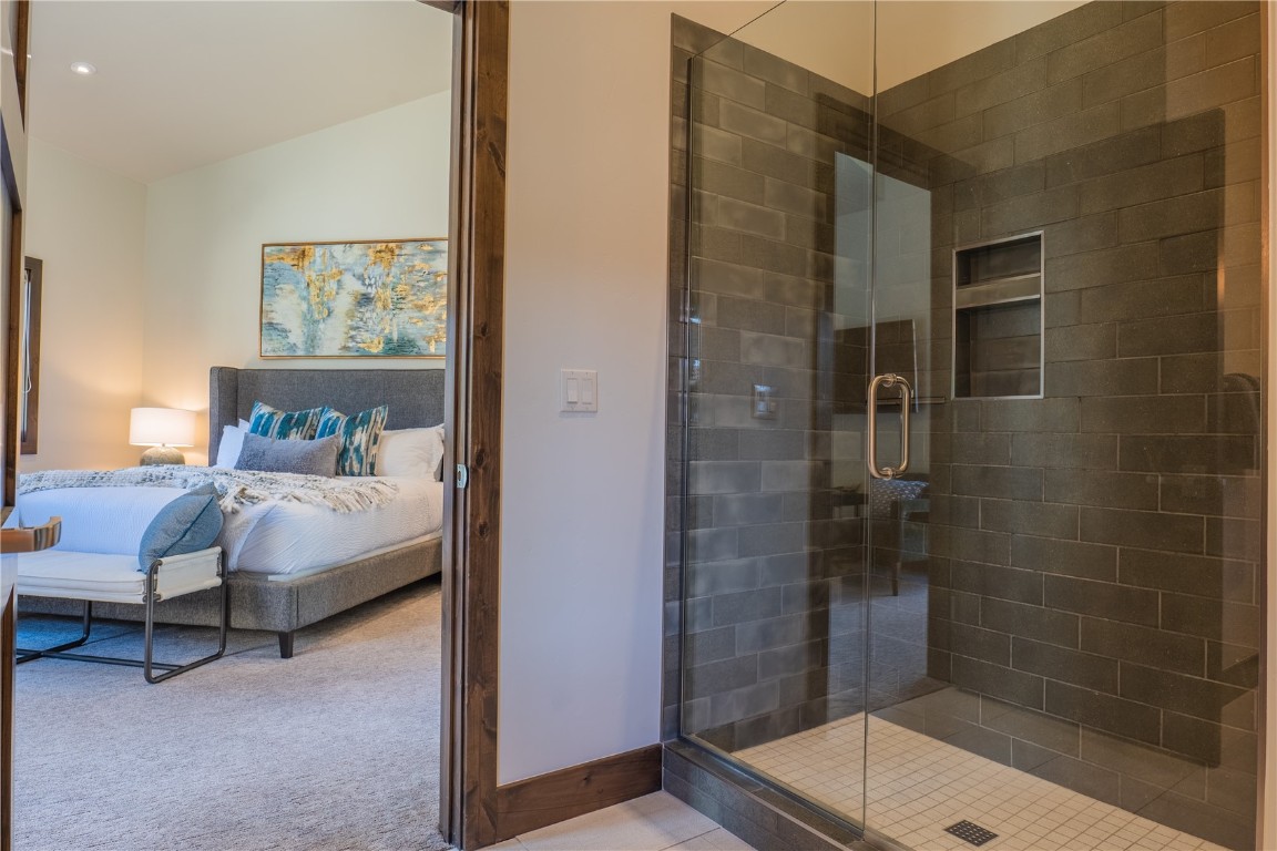 75 West Independence Road Keystone, CO 80435 - Photo 19 of 35 a bathroom with a bathtub and a shower