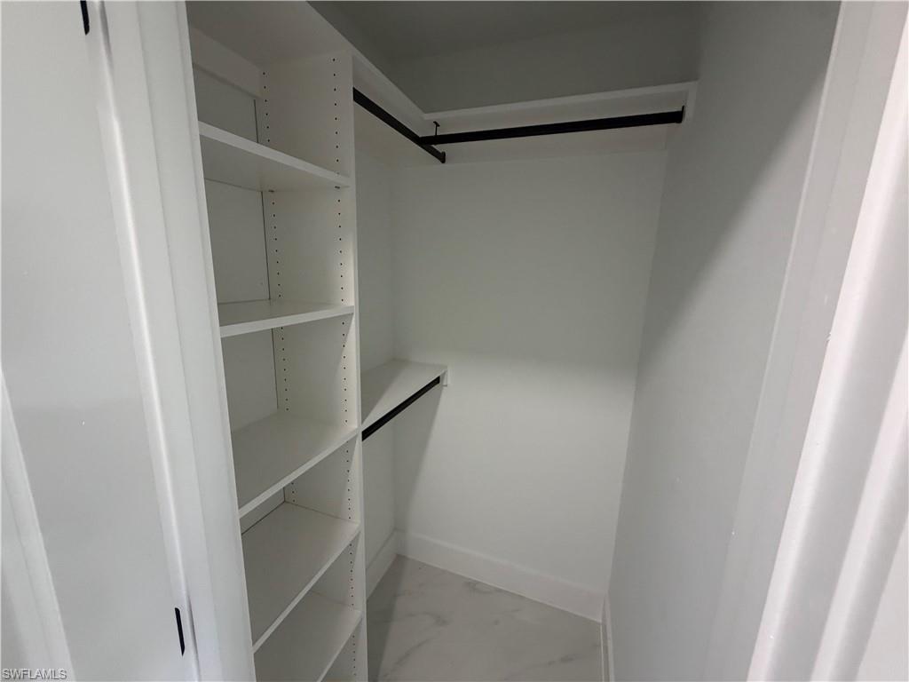 15 Louisiana Road Lehigh Acres, FL 33936 - Photo 19 of 22 a view of walk in closet