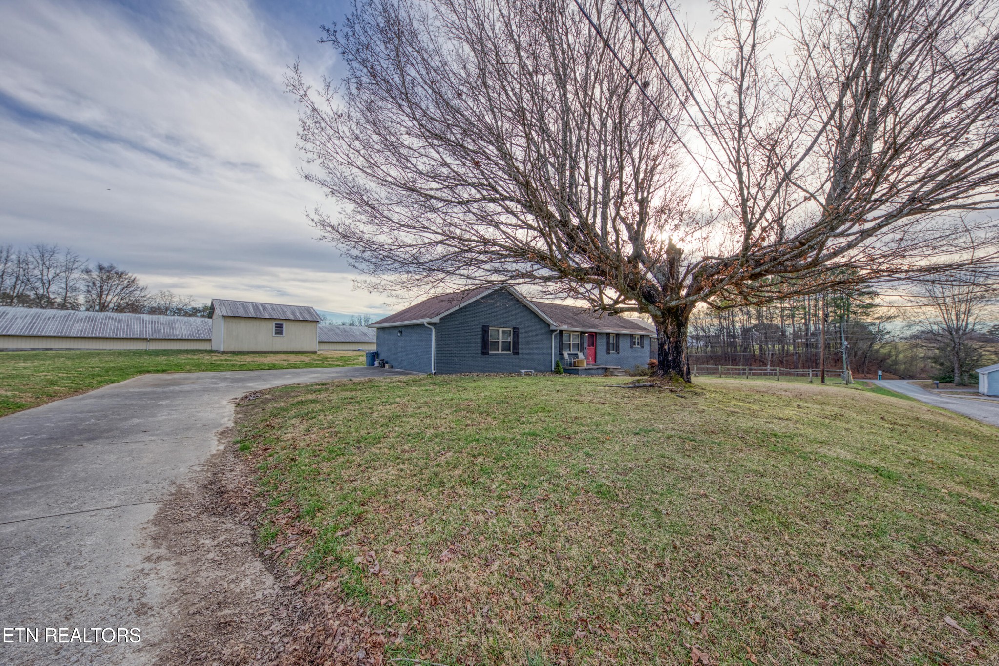 2415 Riddle Road New Market, TN 37820 - Photo 3 of 41 a view of a large house with a big yard and large trees