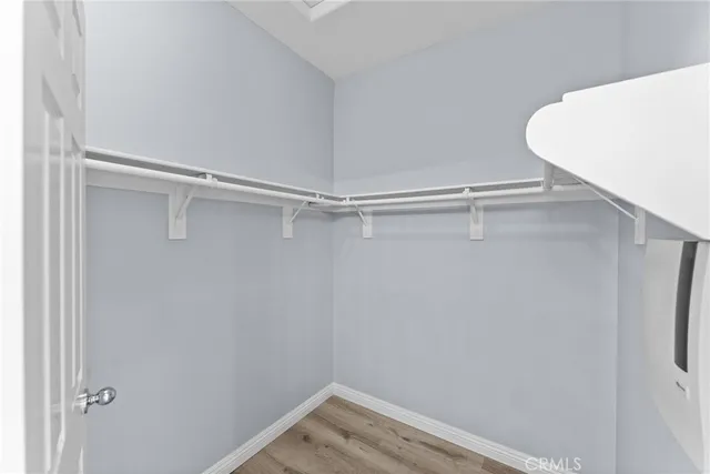 a bathroom with a double vanity sink mirror and bathtub