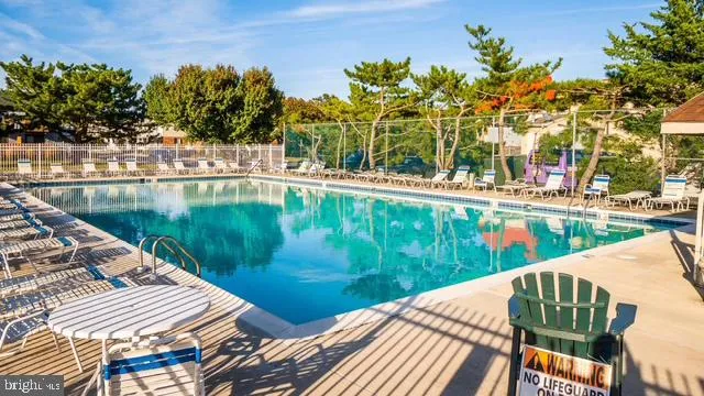 a view of swimming pool with a lake view
