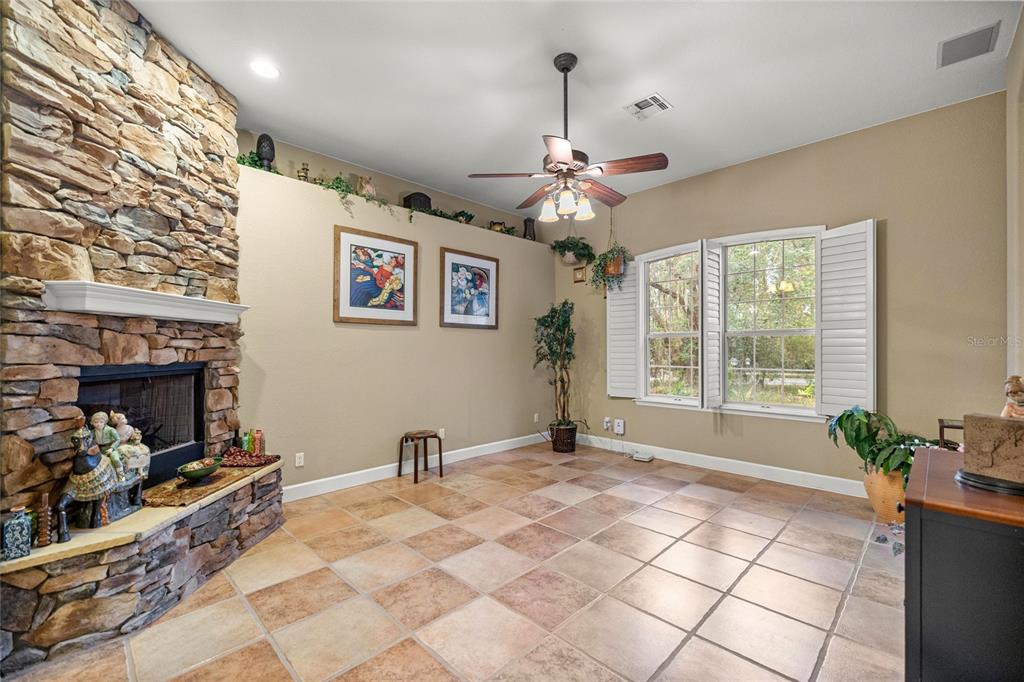 4280 Southeast 26th Terrace Road Ocala, FL 34480 - Photo 15 of 70 a view of a livingroom with furniture and a chandelier
