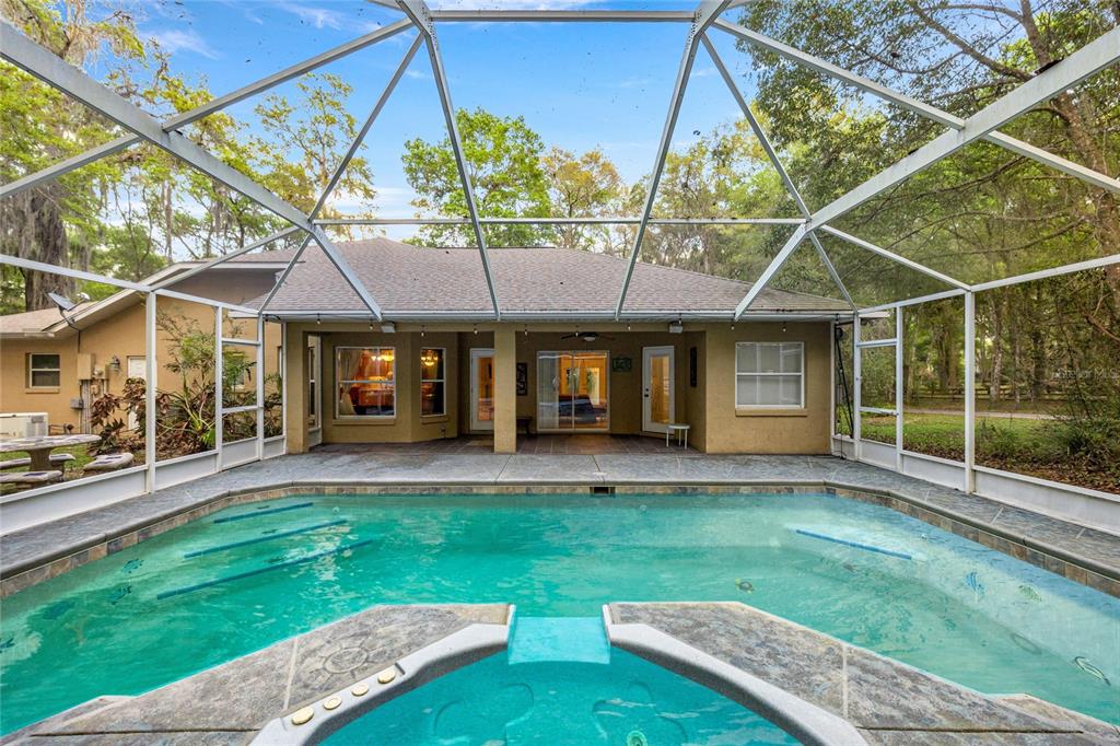 4280 Southeast 26th Terrace Road Ocala, FL 34480 - Photo 3 of 70 a view of a house with a yard and sitting area