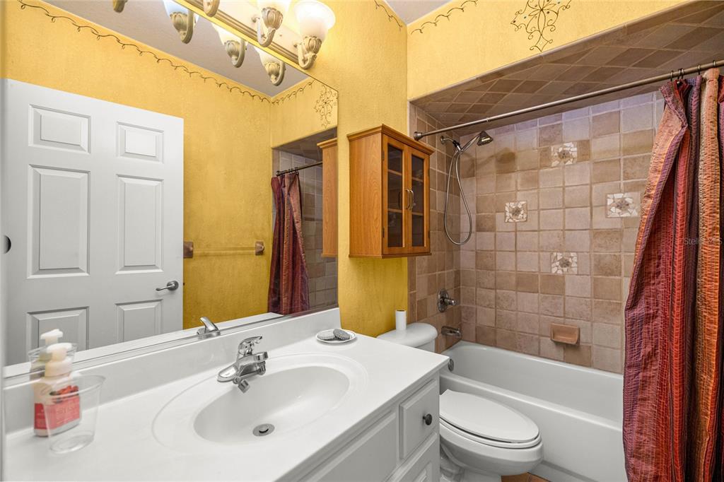 4280 Southeast 26th Terrace Road Ocala, FL 34480 - Photo 34 of 70 a bathroom with a sink a toilet and shower