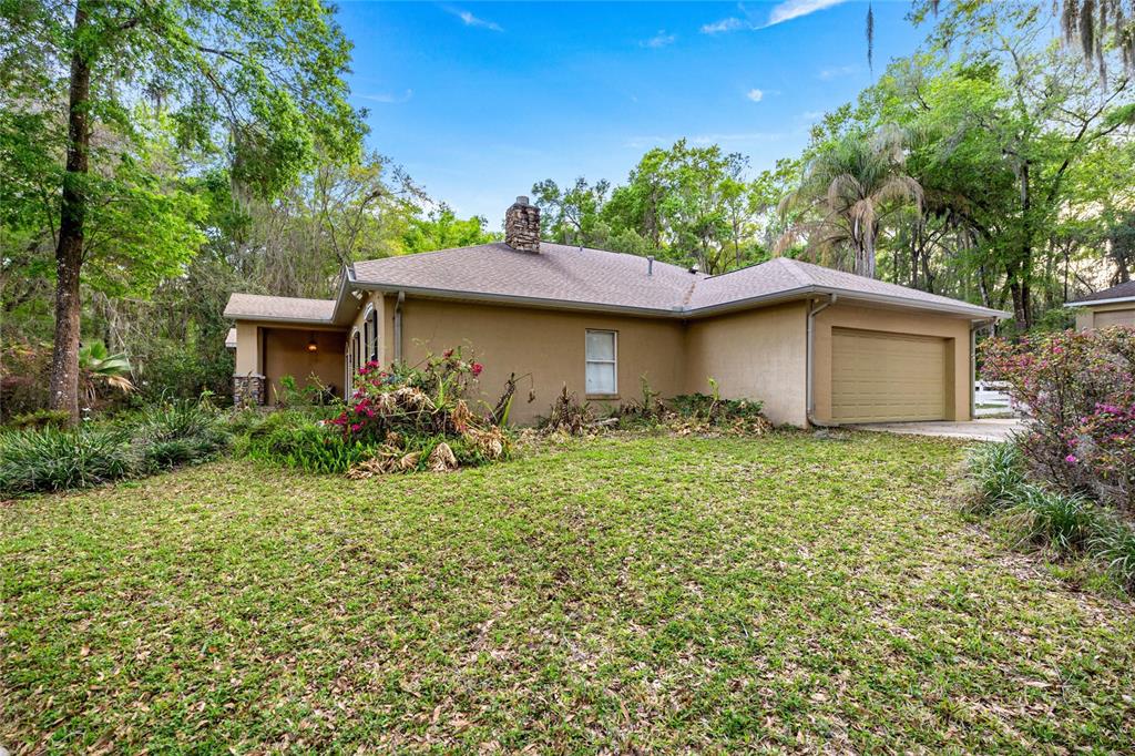 4280 Southeast 26th Terrace Road Ocala, FL 34480 - Photo 56 of 70 a house view with a garden space