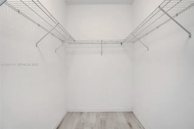 a bathroom with a sink toilet vanity and shower