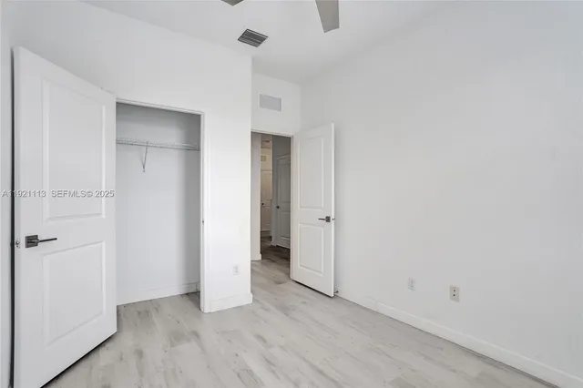 a view of a livingroom with wooden floor