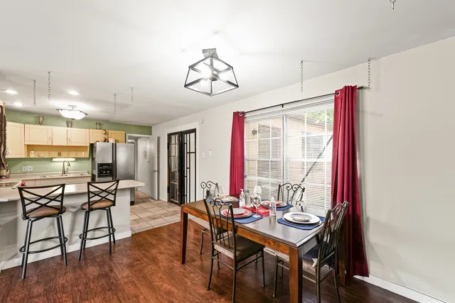 a view of a dining room with furniture window and outside view
