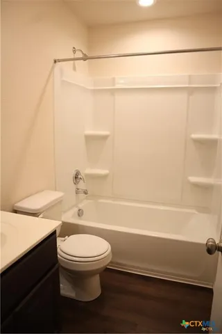 a bathroom with a toilet a sink and a shower