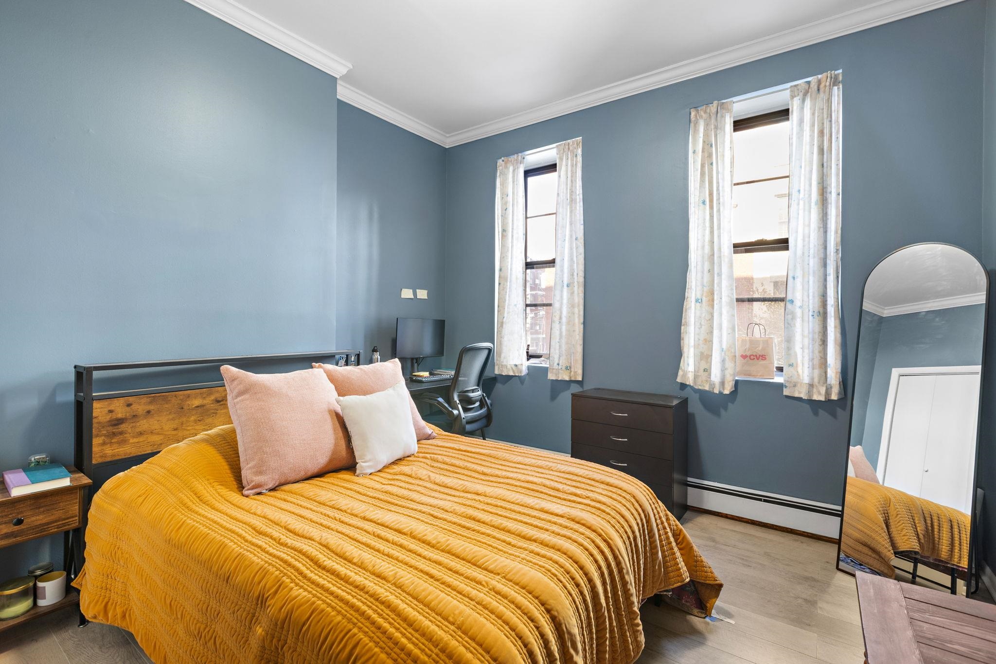 263 1st Street, Unit 2R Hoboken, NJ 07030 - Photo 7 of 13 a bedroom with a bed and wooden floor