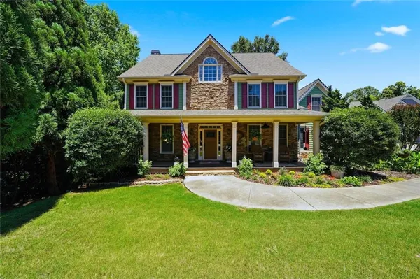 front view of a house with a yard