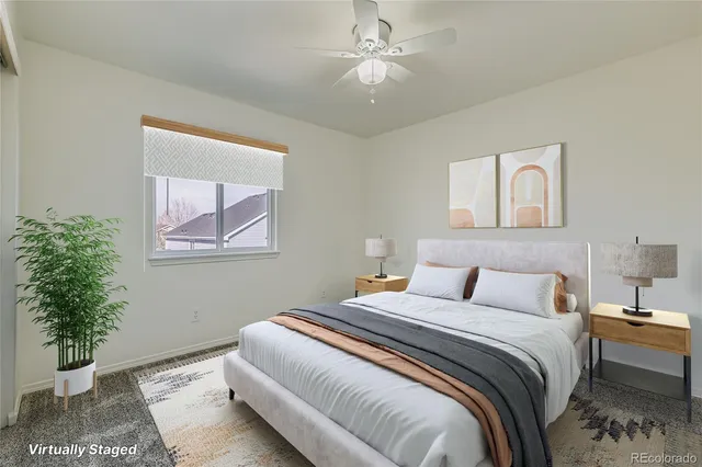 a bedroom with a bed and a painting on the wall