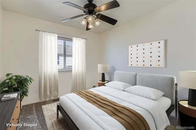 a bedroom with a large bed and a window