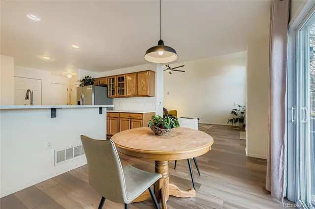 a view of a dining room with furniture and wooden floor