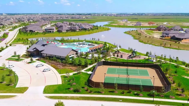 an aerial view of residential houses with outdoor space