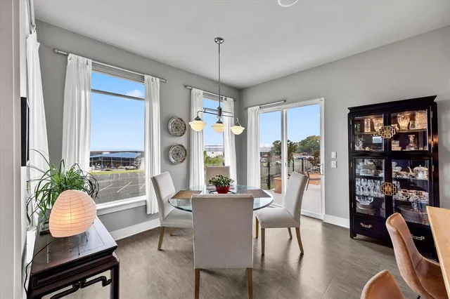 a view of kitchen island a sink and a refrigerator