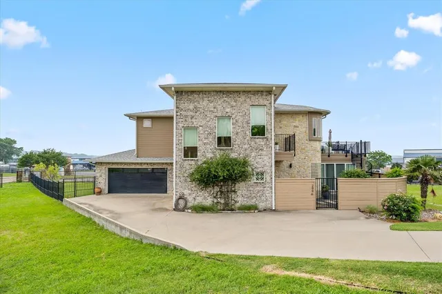 a bedroom with a bed and a lamp