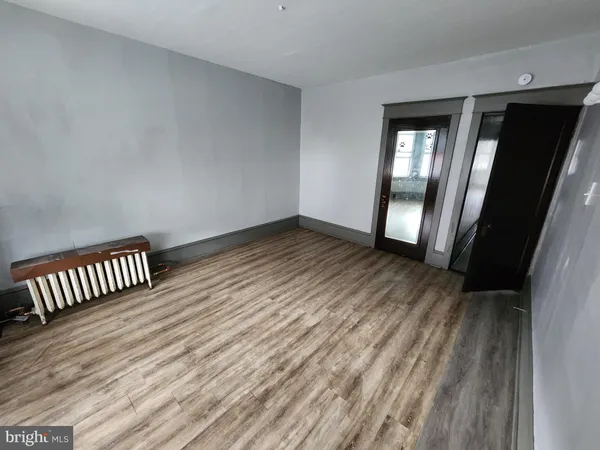 wooden floor in a hall with an entryway