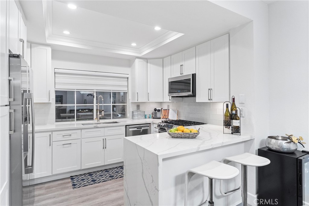 39 Vía Ermitas Rancho Santa Margarita, CA 92688 - Photo 1 of 59 a kitchen with a sink cabinets and wooden floor