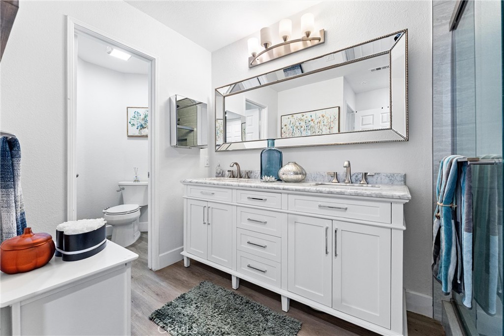 39 Vía Ermitas Rancho Santa Margarita, CA 92688 - Photo 14 of 59 a bathroom with a granite countertop sink vanity mirror bathtub and toilet