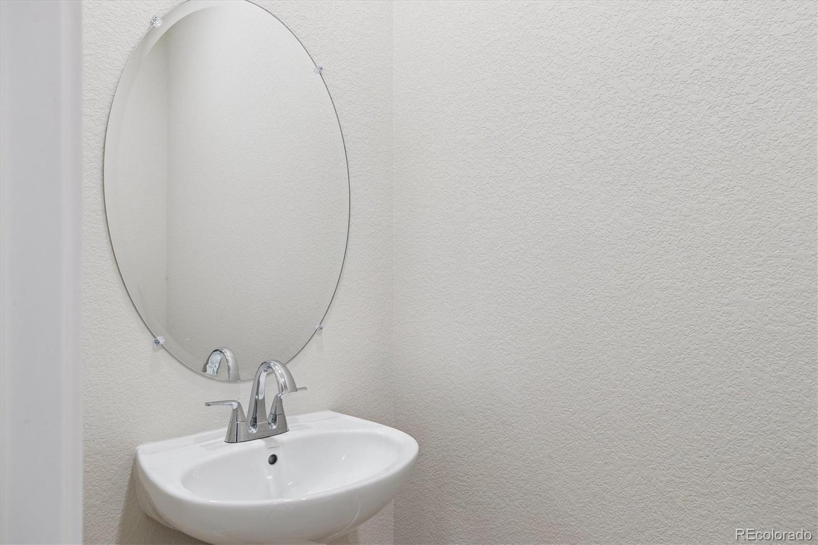 42591 Kinloch Trail Elizabeth, CO 80107 - Photo 11 of 21 a bathroom with a sink and mirror