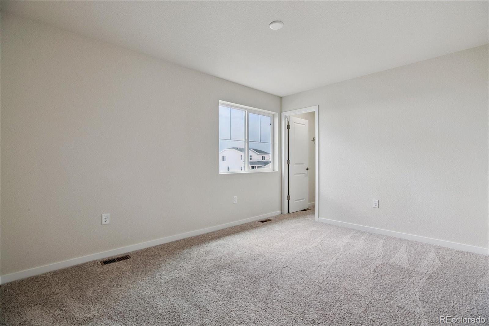 42591 Kinloch Trail Elizabeth, CO 80107 - Photo 16 of 21 a view of an empty room with a window