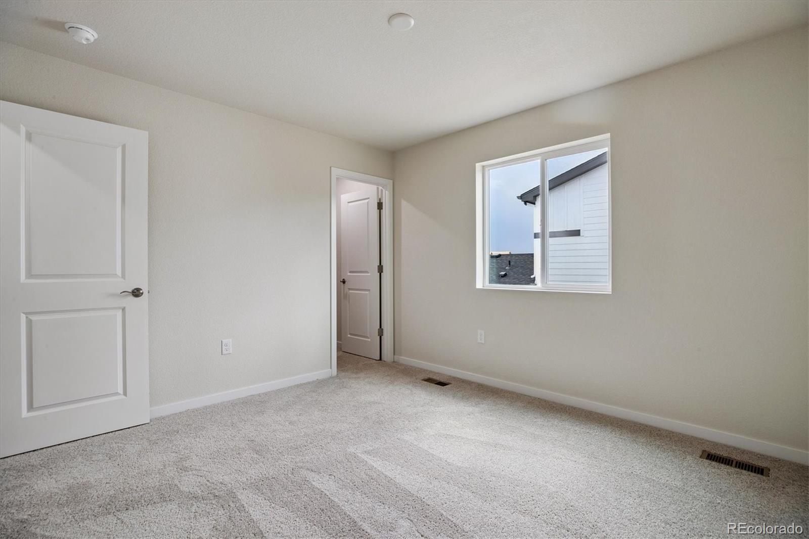 42591 Kinloch Trail Elizabeth, CO 80107 - Photo 17 of 21 a view of an empty room with a window