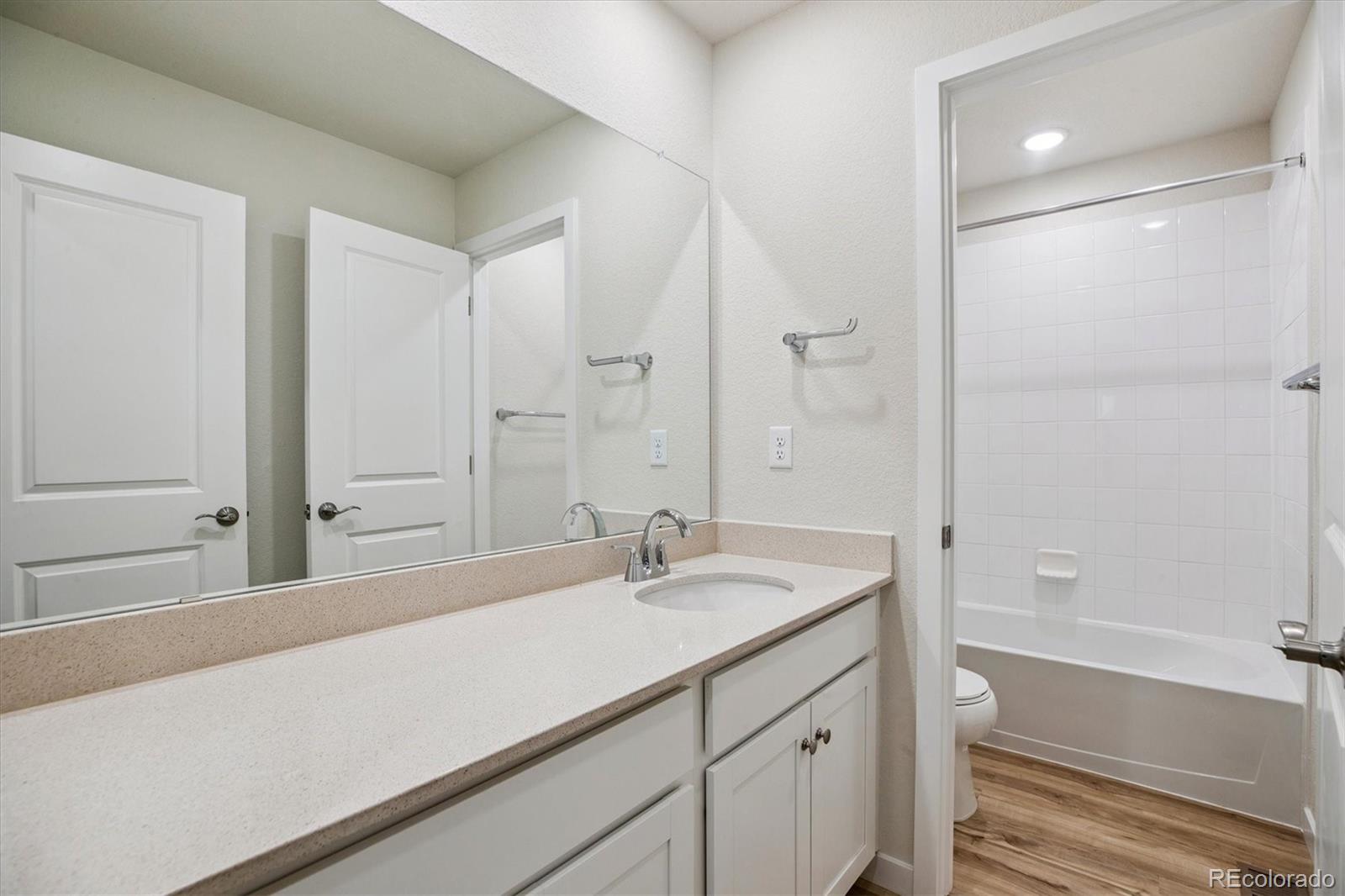 42591 Kinloch Trail Elizabeth, CO 80107 - Photo 18 of 21 a bathroom with a sink and a mirror