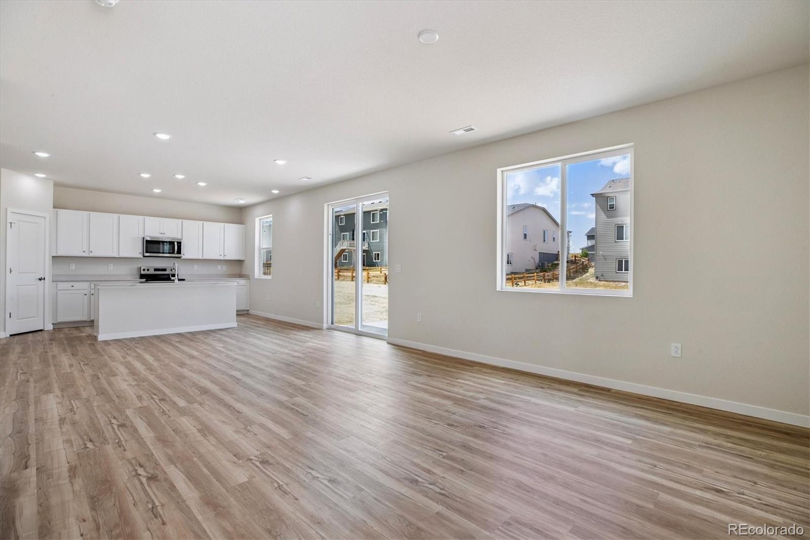 42591 Kinloch Trail Elizabeth, CO 80107 - Photo 7 of 21 a view of a kitchen with wooden floor and electronic appliances