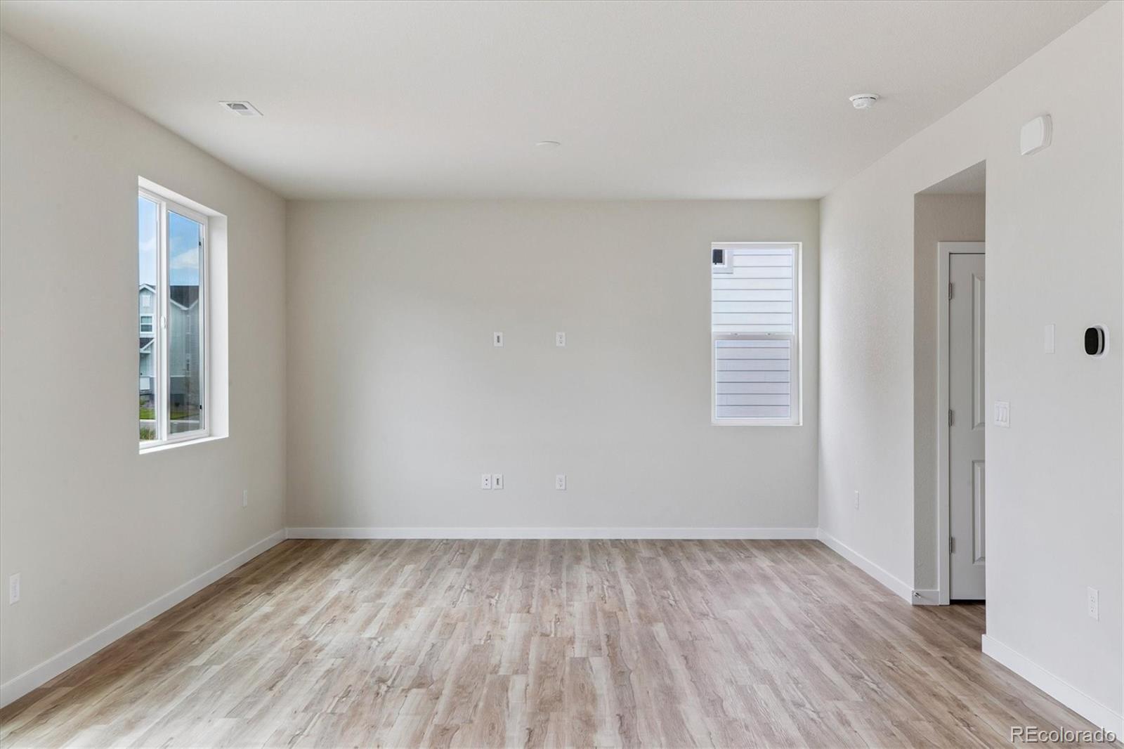 42591 Kinloch Trail Elizabeth, CO 80107 - Photo 8 of 21 a view of a room with wooden floor and window